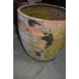 A large terracotta planter, weathered and a few chips, diameter approx. 52cm
