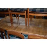 A nice quality vintage teak extending dining table and six (four plus two) chairs, Scandinavian