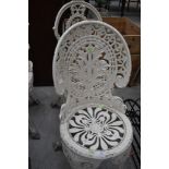 A cast aluminium garden chair, in classical coalbrookdale style