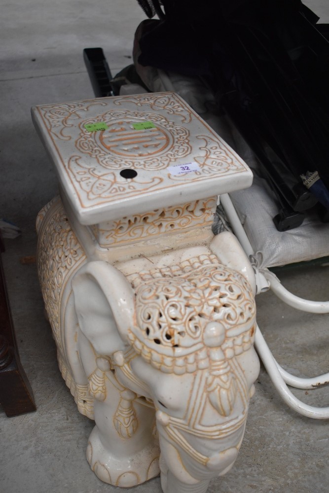 A ceramic elephant seat