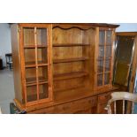 A modern pine dresser having part glazed upper section, width approx. 172cm