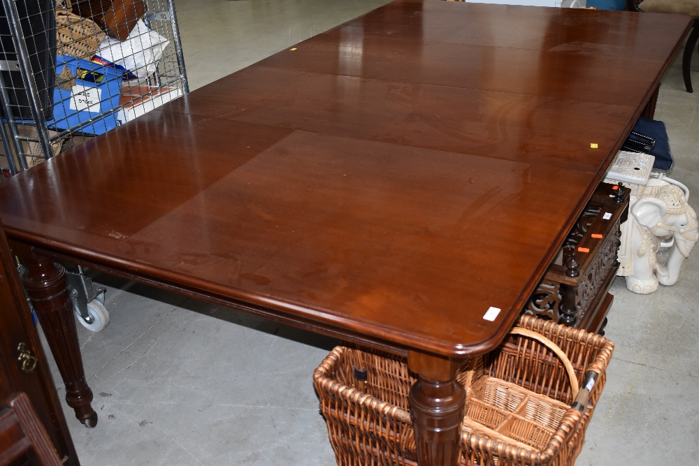 A Victorian mahogany extending dining table, includes winder and two additional leaves, approx.