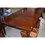 A Victorian mahogany extending dining table, includes winder and two additional leaves, approx.