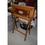 An Edwardian mahogany and inlaid folding desk or work table on stand