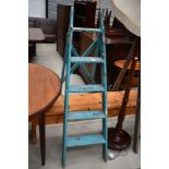 A set of vintage wooden step ladders