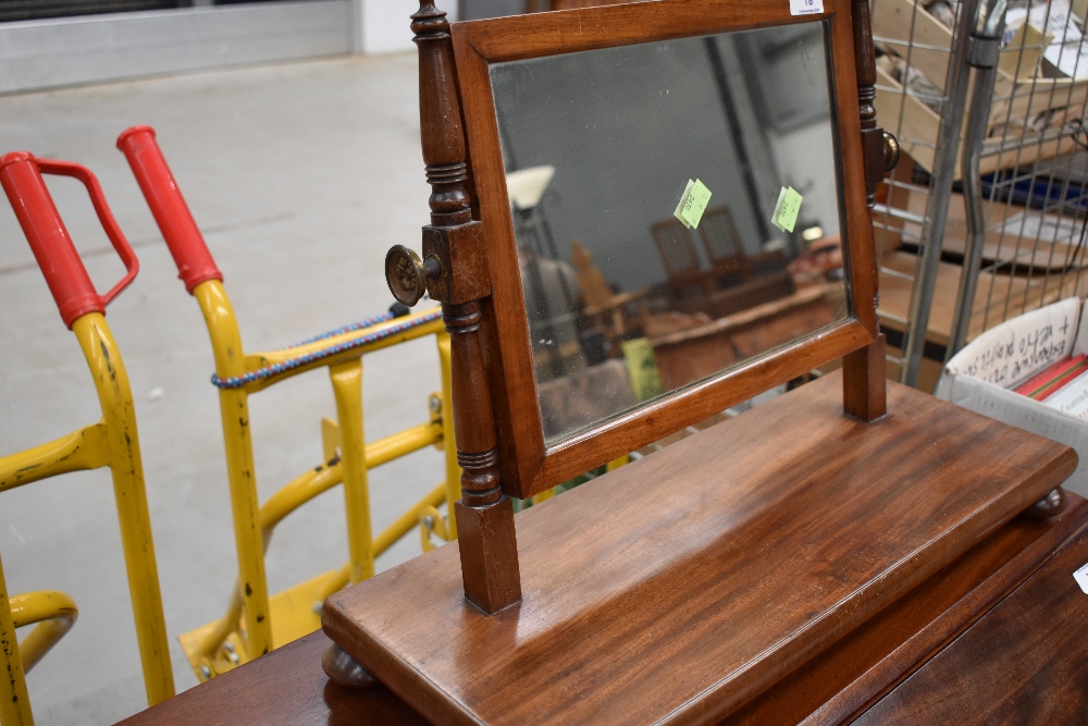 A Victorian mahogany toilet mirror of small proportions on turned frame with plain base, width