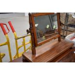 A Victorian mahogany toilet mirror of small proportions on turned frame with plain base, width