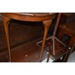 A demi lune hall side table with mahogany veneer