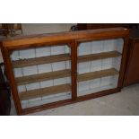 A part Victorian stained frame shallow wall display, width approx. 130cm