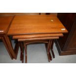 A vintage G plan style teak nest of three tables