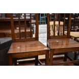 A pair of period oak solid seat dining chairs, in restored condition