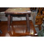 A traditional four legged milking style stool