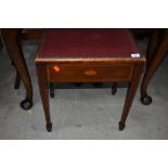An Edwardian mahogany and inlaid piano stool