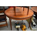 A vintage teak G plan or similar circular extending dining table, diameter approx. 122cm