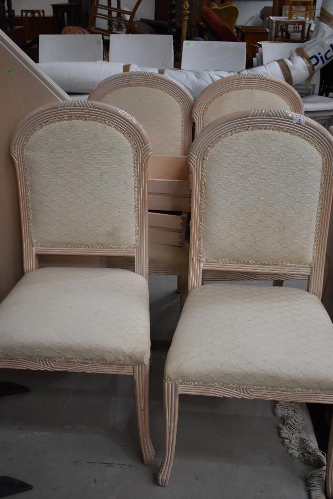 A modern octagonal table chairs and sideboard, gloss finish limed oak and peach effect, sideboard