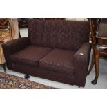 A 1930s settee with original metal casters, finished in brown moquette , good solid frame for a re