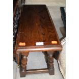 An early to mid 20th Century oak drop leaf occasional table, on twist frame, open dimensions approx.