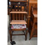 A mid 20th century rail back dining chair and a modern storage rack