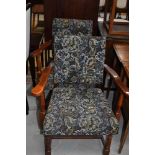 A pair of vintage stained frame and upholstered armchairs