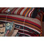 A selection of tribal style floor cushions etc