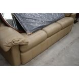 A vintage light brown leather three seater settee, possibly G plan