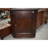 A period oak corner cupboard