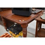 A restored mahogany Victorian wind out table with additional leaf
