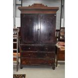 A 19th Century stained frame linen press, on drawer base (two over one deep - false front)