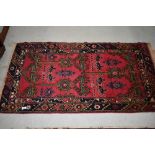 A Persian style fireside rug, approx. 140 x 76cm