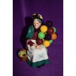 A figure base by Royal Doulton on green back stamp Old Balloon seller