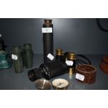 A selection of vintage binoculars, telescope, compass and similar.