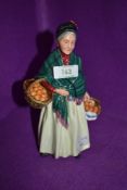 A figure base by Royal Doulton on green back stamp The Orange Lady