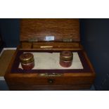 A small late 19th/early 20th century oak folding compartmental box, having section to rear for