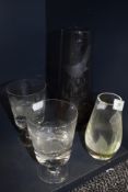 Four items of etched glass including vase with bird design, two glasses with fish decoration and a