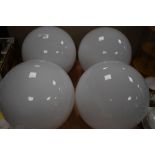 A set of four vintage milk glass globular light shades