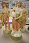 A selection of figures by Royal Dux all figures in good condition including water gilrs and man with