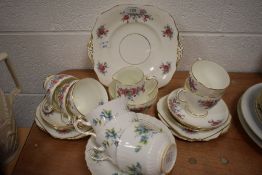 A part tea service by Sampson Smith and similar tea cups and saucers by Hostess