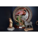 A selection of figurine,including zebra,flamingo and Aynsley otter also a micro mosaic charger.AF