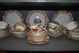 A collection of cups and saucers,plates,bowl and jug having brown, green and navy pattern with