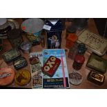 A selection of advertising items including transfer printed tins