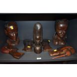 A selection of African tribal hand carved heads and masks including Maasai style heads