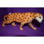 A ceramic figure of an African cat possibly Cheetah by Beswick