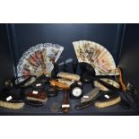 An assortment of dressing table mirrors, fans, glove stretchers,hallmarked brush, candle stick