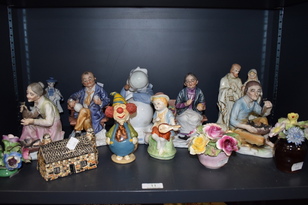 An assorted lot of figurines and ornaments among which are Crown Staffordshire and similar floral