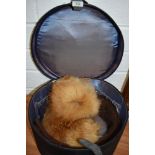 A vintage travel case/ hat case a fur stole/collar and similar.