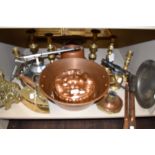 A selection of fire side stove and cooking items including large copper jelly mold candle sticks and
