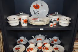 A large quantity of Wedgewood in a Susie cooper design 'corn poppy' dinner service, including