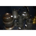 A selection of plated wares and pewter among which are a decorative teapot with embossed design