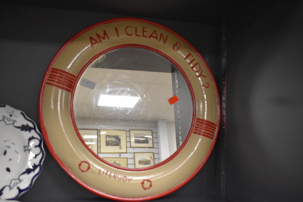 A vintage metal framed Lifebouy soap advertising mirror.