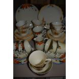 Two art deco tea services both having floral designs one being hand painted